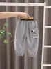 2026 Nuevo Modelo Pantalones para Niños Primavera y Otoño Corte Holgado Pantalones Casuales Elegantes Pantalones Deportivos para Bebés Niños Tendencia Venta al por Mayor