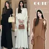 Elegante atuendo de otoño para mujer: un conjunto de dos piezas nuevo, chic y de corte holgado que presenta un top de punto con manga murciélago y una falda midi plisada