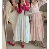 Falda de pastel Primavera Nueva Ropa exterior para mujer Cintura alta Aspecto adelgazante Falda de línea A drapeada Versátil de longitud media Dulce