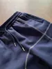 Pantalones de chándal azul oscuro estilo americano de marca de moda línea Hasselblad con dobladillo curvo fluido, diseño relajado, pantalones casuales de pierna ancha estilo ins