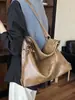 Bolso de mano retro de gran capacidad, nuevo estilo 2026, bolso de hombro versátil para mujer para el trabajo, bolso casual de moda, bolso hobo de moda