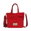 Bolso tipo cubo de lunares rojos estilo coreano para mujer, nuevo modelo 2026, bolso cruzado casual ligero de lona, bolso de mano pequeño para el trabajo y artículos varios