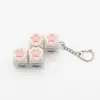 Chaveiro Botão Luminoso de Patinha de Gato Chave de Teclado Switch Tecla de Teclado Brinquedo Descompressão Pingente de Bolsa Chaveiro