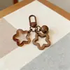 Chaveiro Dupla Estrela Sino Pingente Estrela Fofa para Mochila Acessório Acrílico Feminino Estilo Ins