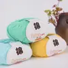 Algodón puro bola de lana hilo de leche hilo de algodón hilo para bebé hilo para muñeca hilo de algodón para crochet lana para niños venta al por mayor de fábrica