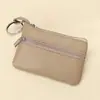 Billetera pequeña de color sólido de piel de vaca de capa superior, monedero portátil, mini ultra-delgada de cuero con cremallera, monedero para mujer, venta directa de fábrica