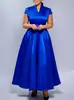 D643 Moda europea y americana para mujer, vestido largo de color liso brillante elegante con cuello en V, manga corta y bajo ancho para exportación