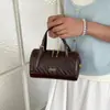 Bolso bandolera coreano texturizado con un toque de lujo ligero, bolso pequeño cuadrado simple de verano, nuevo bolso de hombro tejido versátil para mujer 2026