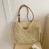 Bolso tejido nuevo transfronterizo 2026, moderno y a la moda, elegante bolso de hombro y axila, bolso de mano de paja, bolsa de playa para vacaciones