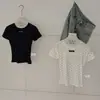 Wgwe9955 Ropa de Mujer Guangzhou Shisanxing 2026 Verano Nuevo Cuello Redondo Lunares Hombro Normal Manga Corta Camiseta Top Delgado