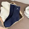Meias com laço para mulheres, meias de cano médio com costura dupla, meias estilo coreano ins para primavera e outono, combinadas com sapatos de couro pequenos, meias femininas com etiqueta de tecido Zhuji