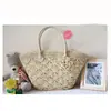 Fabricantes de artesanía hueca doble-abanico con mango de cuero una flor bolso de hombro tejido de paja de moda bolso de ganchillo