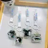 Popular Requintado Preto Dourado Infundido com Óleo Areia Líquida Panda Pingente Chaveiro Moda Estudante Bolsa Chaveiro de Carro Atacado