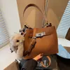 Bolsos Retro de Gama Alta de Nicho Transfronterizos para Mujer 2026 Primavera Nuevo Versátil Casual Bolso Cruzado Bolso de Mano Bolso Cubo