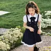 Vestido Novo de Verão 2026 para Meninas, Estilo Academia com Laço, Manga Curta Justo com Gravata, Modelo A-Line Tendência
