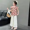 Conjunto de Princesa para Niña Verano 2026 Dos Piezas Nuevo Elegante Estampado Floral Niños Manga Corta Pantalón Ancho Conjunto Moderno