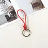 Pulsera tejida a mano cuerda de cuero llavero pareja simple colgante tejido cuerda de cuero vintage cuerda de llave colgante de bolsa joyería