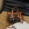 Bolsas de Mujer Transfronterizas 2026 Nueva Moda Trendy Cesta de Flores Viejas Bolso de Mano Bolso de Hombro Versátil Bolso Cruzado de Mujer Lujo Ligero