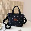 Nuevo bolso de mano impermeable casual de lunares transfronterizo, bolso de gran capacidad para el trabajo, bolso de hombro y cruzado versátil y de moda para mujer