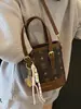Versão Coreana da Nova Bolsa de Balde Portátil de Moda Clássica Estampada de Alta Qualidade, Bolsa Transversal de Temperamento Nicho para Mulheres Estilo Comutador