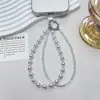 Nuevo accesorio de llavero corto para bolso, correa de teléfono de doble capa de cristal de perla de lujo, versátil