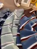 Suéter de punto con cuello polo y media cremallera a rayas retro japonés para hombre y mujer, estilo perezoso holgado de invierno, top de diseño de nicho