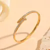 Versátil Transfronterizo Acero Inoxidable Electrochapado al Vacío Joyería Flor Pequeña Patrón de Ojo Varios Brazaletes para Mujer Brazaletes de Diamante