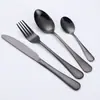 Fabricante 1010 Acero Inoxidable Chapado en Titanio Cubiertos Cuchillo para Filete Tenedor Cuchara Hogar Hotel Comida Occidental Cuchillo y Tenedor Juego de Cuatro Piezas