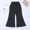 Pantalones cargo acampanados negros para niña para otoño, adecuados para la escuela y para usar al aire libre. Pantalones cargo de tiro alto para niños, adelgazantes, con un ligero acampanado, disponibles en stock