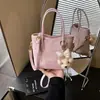Bolso Cubo Retro de Nicho Casual de Moda Transfronterizo 2026 Primavera Nuevo Color Sólido Ligero para Viajar Bolso Cruzado al Hombro