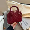 Bolsa Feminina Textura Moderna Comércio Exterior 2026 Nova Xadrez Concha Versátil Ombro Único Sobrancelha Bolsa de Mão para Senhoras