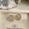Pendientes de Gota de Aceite Púrpura Sueño Estilo Corte Retro Francés Diseño con Sentido Relieve Pendientes de Mariposa Medio Antiguo de Alta Gama