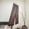 Novas Calças Casuais de Couro PU Estilo Chinês Cor Sólida Design Nacional 2025 Outono Novas Calças de Moda Casuais Versáteis para Mulheres