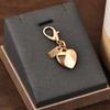 Colgante para llave de coche, bolso de gran sentido, accesorios de color dorado, oso, cereza, trébol de cuatro hojas, mariposa, bolso escolar, joyería al por mayor
