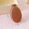 Pente dobrável simples personalizado em formato de macaron para mulheres, pente massageador desembaraçante com espelho de maquiagem portátil integrado