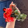 Vehículo de construcción de aleación caricatura creativa mini mochila colgante de llavero clip de regalo muñeco máquina juguete especial venta al por mayor