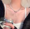 Collar de borlas de perlas y lazo de alta gama, elegante y moderno, con diseño que combina con todo, para mujer, cadena de clavícula ligera y de lujo.