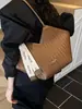 Bolso de hombro tejido con patrón transfronterizo para mujer, nuevo bolso de hombro de diseño de nicho de moda otoño e invierno 2026, bolso de mano popular