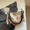 Bolso de mano tipo chino 2026 Primavera Nuevo Gran Capacidad Casual Cadena de Perlas Bolso de Hombro para Axila Tote para Mujer