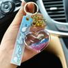 Llavero con colgante de amor de arenas movedizas, acrílico, corazón de melocotón, aceite que fluye, campana creativa, lindo llavero de bolso escolar para mujer