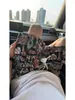 Shorts de Playa con Graffiti de Seda de Hielo Secado Rápido Transpirables Verano Nuevos Shorts Casuales Estampados para Hombre Pantalones de Cinco Puntos Sueltos Marca de Moda