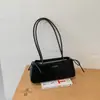 Bolso de axila de nicho estilo francés para mujer, nueva colección otoño/invierno 2026, bolso de hombro casual retro, bolso baguette de alta gama para el trabajo