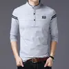 Camiseta de algodón de manga larga para hombre cuello liso color sólido joven y de mediana edad coreana ajuste slim camiseta interior ropa de otoño guapa venta al por mayor para hombre