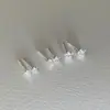 Pendientes de circonita con diseño de nicho, con forma de estrella de cinco puntas, para mujer, con forma de hueso de oreja, pequeños y exquisitos, de alta calidad, a la moda.