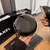 2025 Moda Versátil Bolso Redondo Pequeño Tendencia Personalidad Color Sólido Bolso de Hombro o Muñeca Bolso de Diseño de Nicho de Tendencia para Mujer