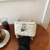 Bolso caja elegante de estilo coreano transfronterizo inspirado en Chanel, bolso cruzado de cadena nuevo y versátil de nicho para el transporte diario de estudiantes universitarios