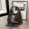 Bolsa Tote de Gran Capacidad Transfronteriza para Mujer 2026 Primavera Nuevo Estilo Coreano Retro Casual Bolso de Hombro Mochila Simple de Moda