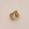Estilo minimalista entrelazado ear cuff de circón micro pavimentado clip de oreja de personalidad coreana pendiente de aro de oreja de moda simple y versátil