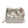 Bolso de cadena con patrón de rombos estilo coreano para mujer, nuevo modelo 2026 bandolera, diseño de nicho de verano, bolso cubo popular de un solo hombro