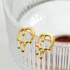 Pendientes de diseño de alta gama de moda europea y americana, chapados en cobre oro de 18 quilates, pendientes de gota de lava líquida, clip para el cartílago del oído
